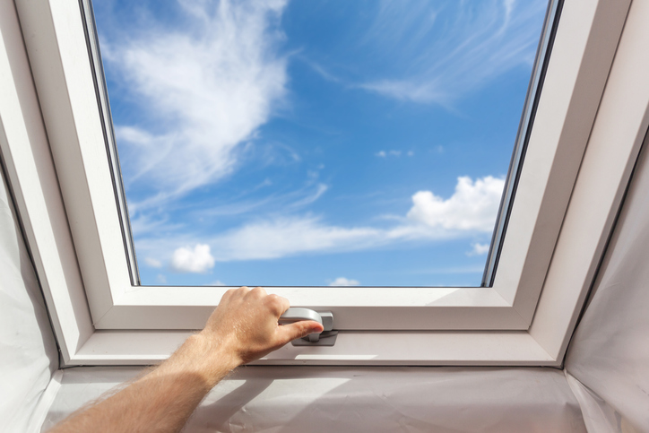A skylight under the blue sky and clouds installed via CAN/CSA A440.4-2019 performance requirements.