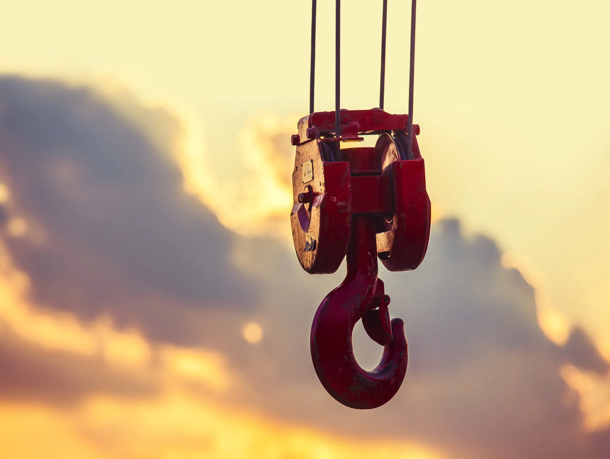Red hook under lifting sling under the sunset kept safe to ASME B30.