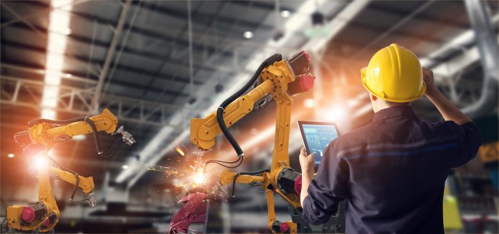 Man oversees the use of heavy machinery that meets standards published on the ANSI webstore