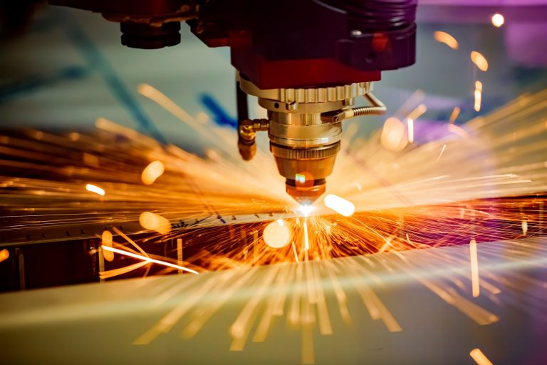 Laser that conforms to ANSI Z136.9 cutting through metal