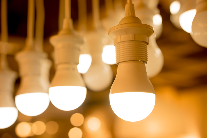 Multiple hanging light bulbs that follow ANSI/IES LM-79-19