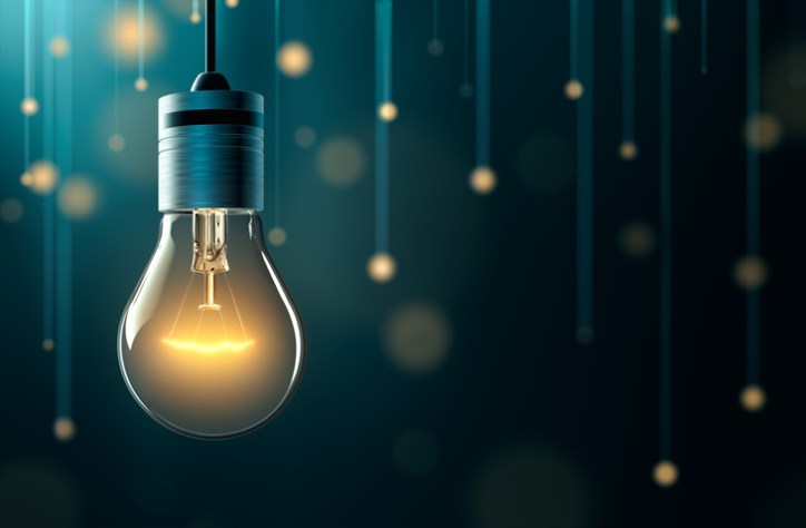 Yellow lightbulb driving innovation and ISO 56002:2019 Management Systems