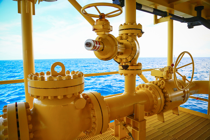 Yellow process piping that follows the ASME B31.3 2020 code offshore.