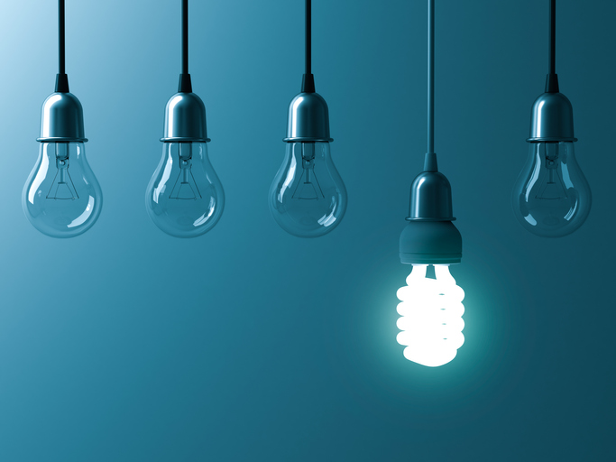 Bright bulb represents the ISO 50001:2018 energy management standard.