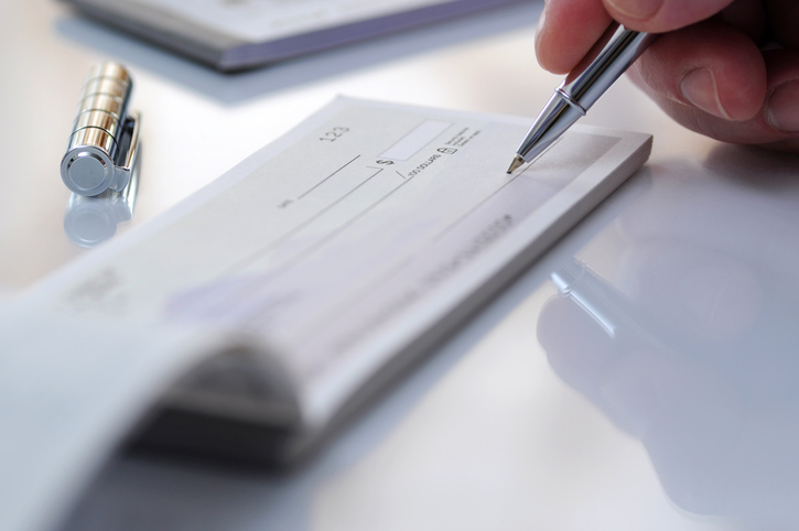 Someone writing a check that has a MICR that is protected by ANSI X9 Standards