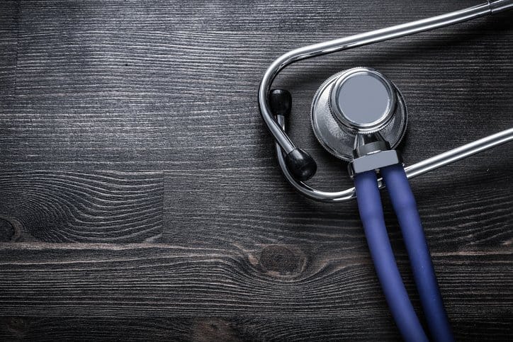 Medical Device Stethoscope on wood adhering to ISO 15223-1:2016 for symbols on medical device labels