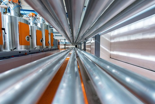 Rows of chrome pipes subject to heavy corrosion in geothermal energy production.