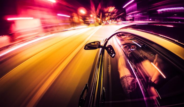 Psychedelic car breezing through road, colorful from measured SAE J 2805-2020 sound emissions