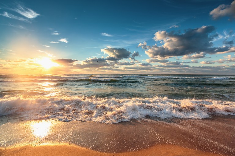 A sunset cast over the receding tide demonstrates the future of accreditation relating to the Carbon XPRIZE.