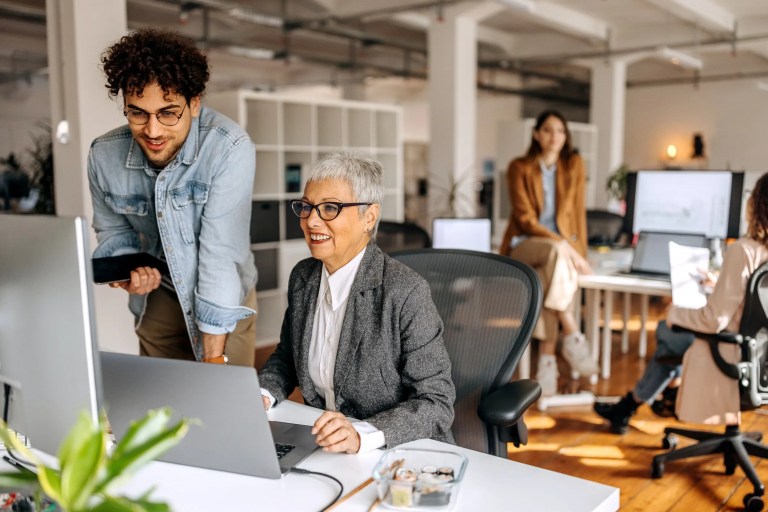 Older businesswoman in an office getting Workcred credentials.