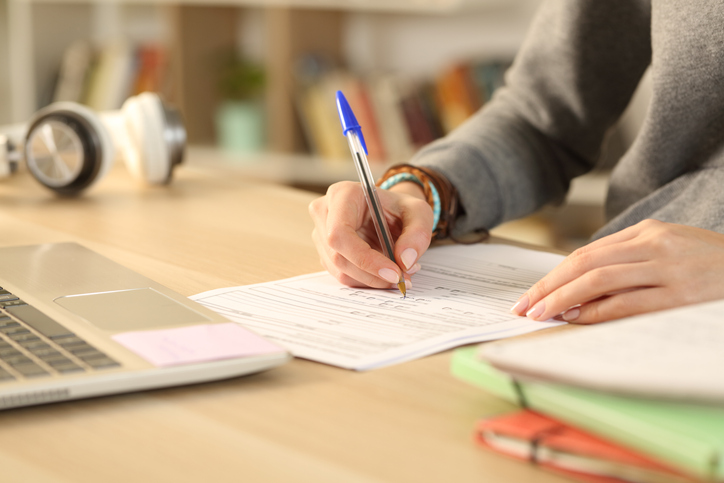A certificate issuer filling out FM 7304 application for ANAB accreditation to ASTM E2659-18 to help assessors.