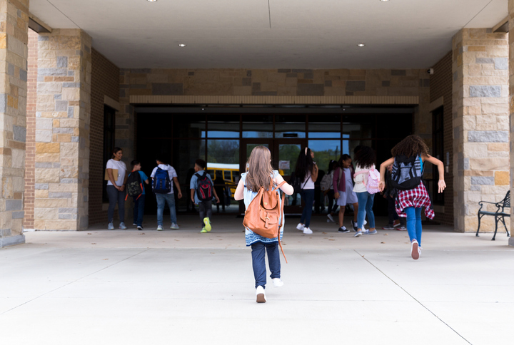 Kids running into school building that has been tested for radon through ANSI/AARST MALB.