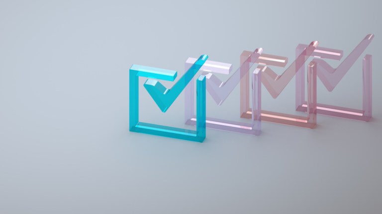 Colorful check marks to indicate an ISO 37301:2021 compliance management system to meet standards, laws, and codes.
