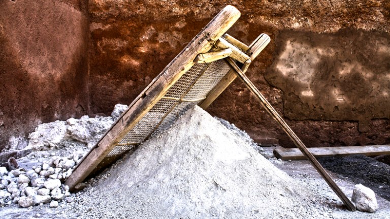 White quicklime sifted through traditional tool in Marrakech just like how it was used in warfare.