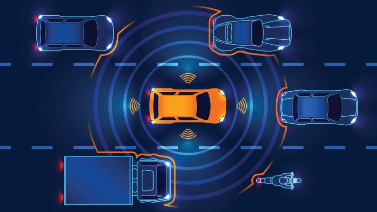 Orange car operating at Level 1 of the SAE levels of driving automation.