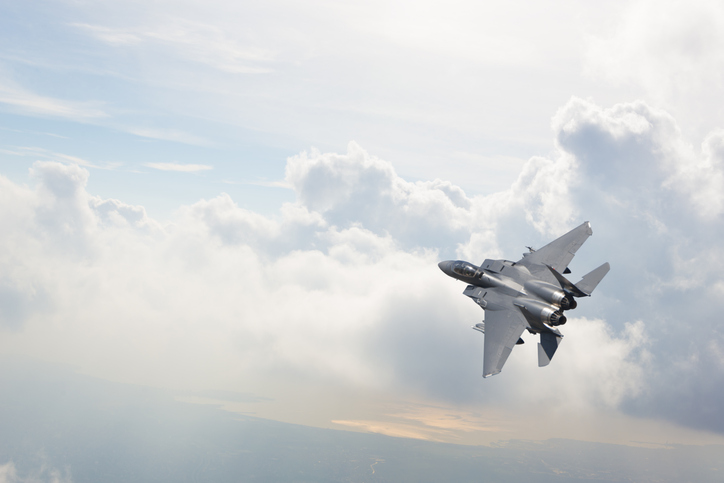 Fighter jet that was constructed with additive manufacturing flying above the clouds.