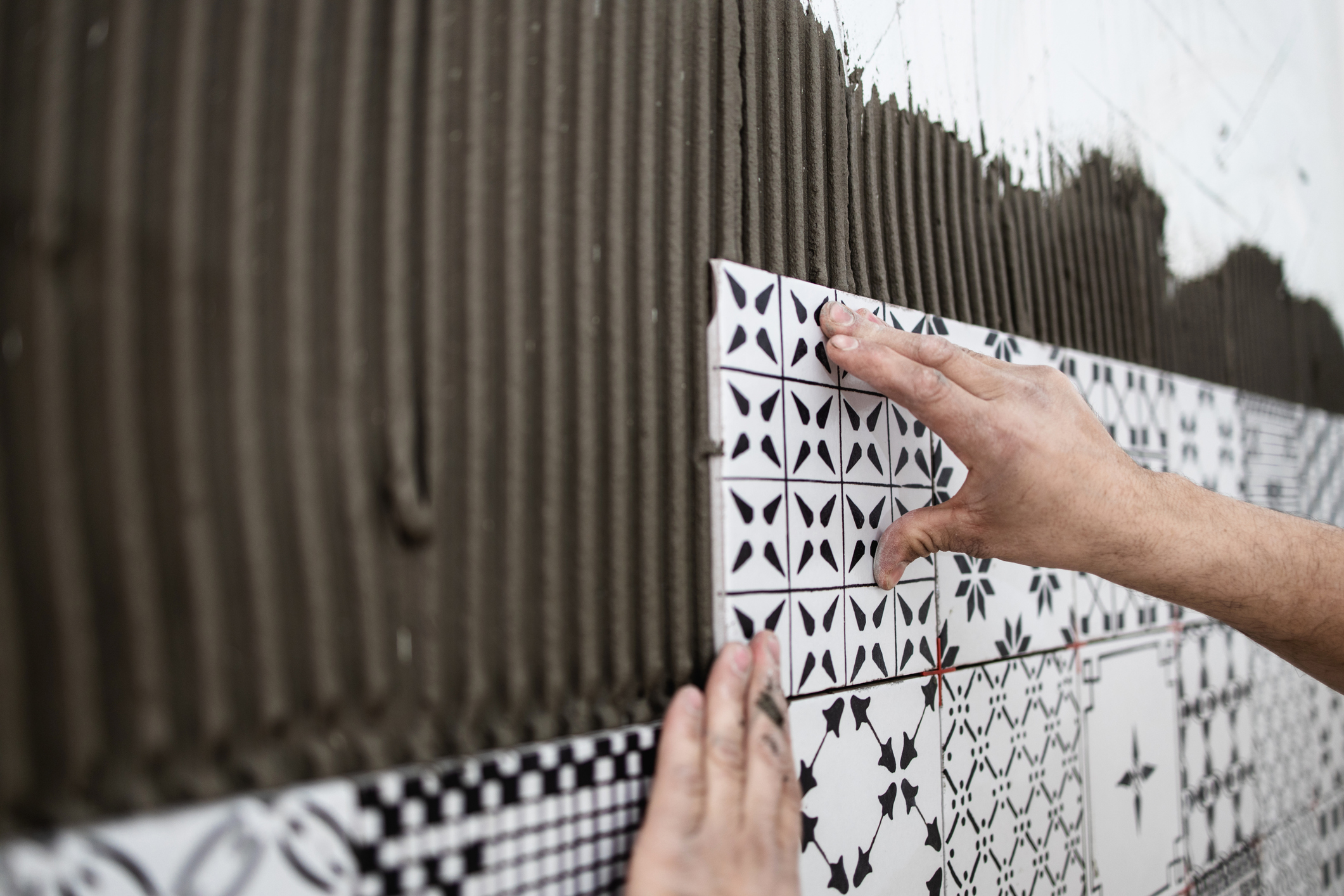 Some ceramic tile being installed to ANSI A137.1:2021 specifications.