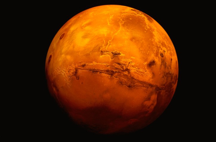Mars red planet with surrounding black space, on which 3D printing will one day thrive.