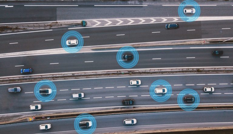 Cars on highway depending on automated driving systems outlined in SAE J 3016-2021.