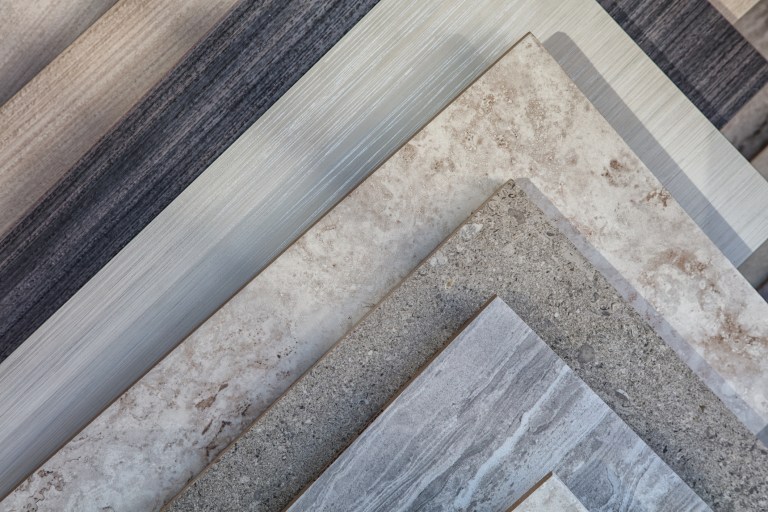 Stacked gray ceramic tiles following ASTM and referenced in ANSI A137.1