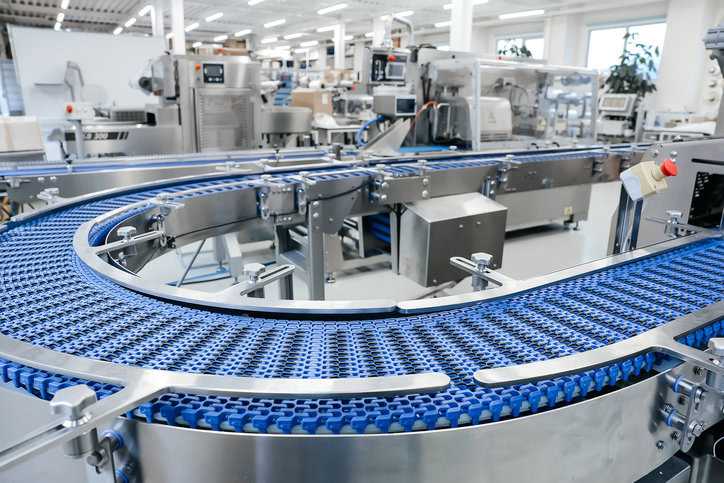 Empty blue conveyor belt in modern factory.