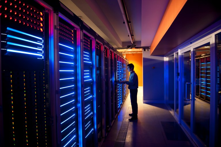 IT engineer in action with new ISO/IEC 27001 and 27002 information security management systems requirements.