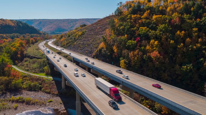 PA Turnpike carrying cars as a highway and freeway with a difference between the two.