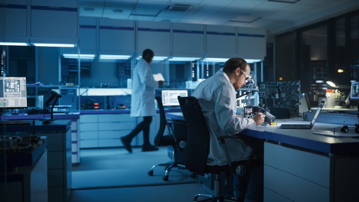 Lab technicians working on statements of conformity to prepare for ISO/IEC 17025 accreditation.