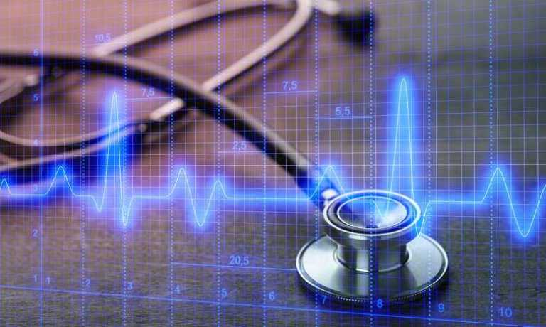Stethoscope planted over blue graph representing patient technology.