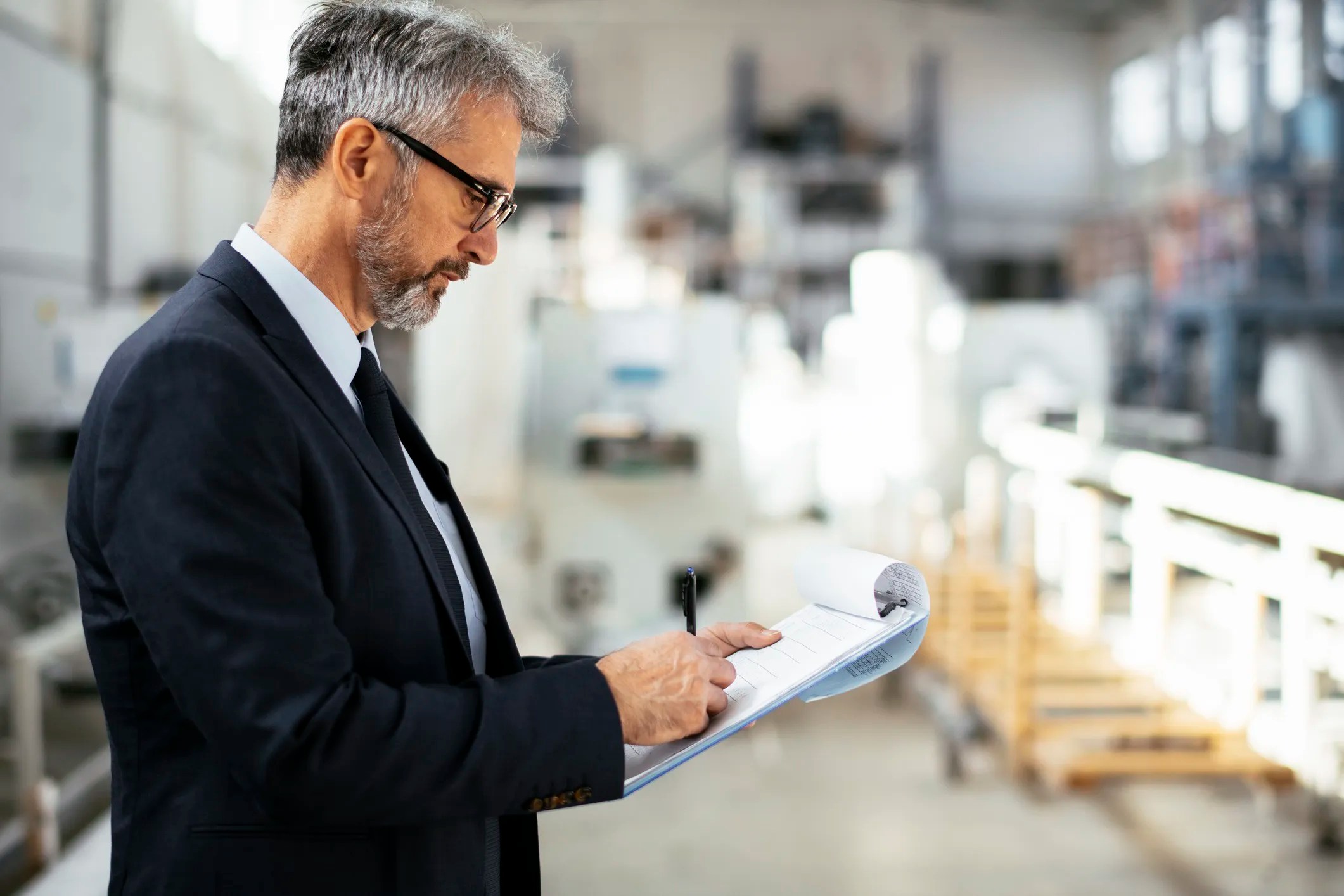 Workcred worker inspecting a factory for certification.