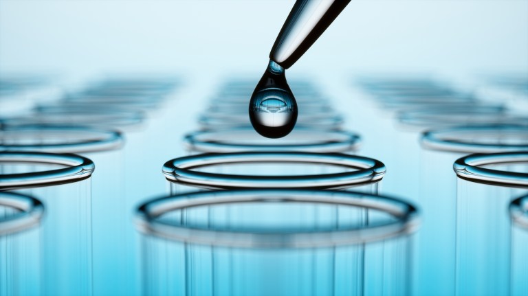 Dripping water into test tube to test sample through ASTM D4840 sample chain-of-custody procedures.