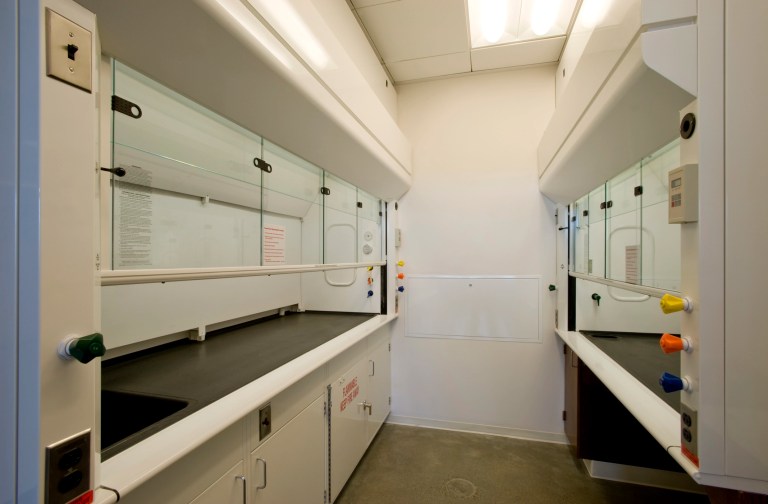 Two laboratory hoods in plain white room tested to ANSI/ASHRAE 110-2016.