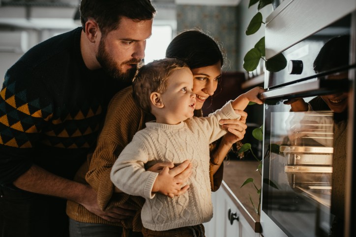Family adoring perfect oven due to it undergoing ISO/IEC 17065 product certification and ANAB accreditation.