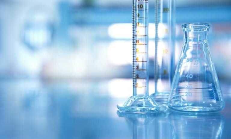 Three beakers that can yield different measurements, showing the importance of labs reporting measurement uncertainty.