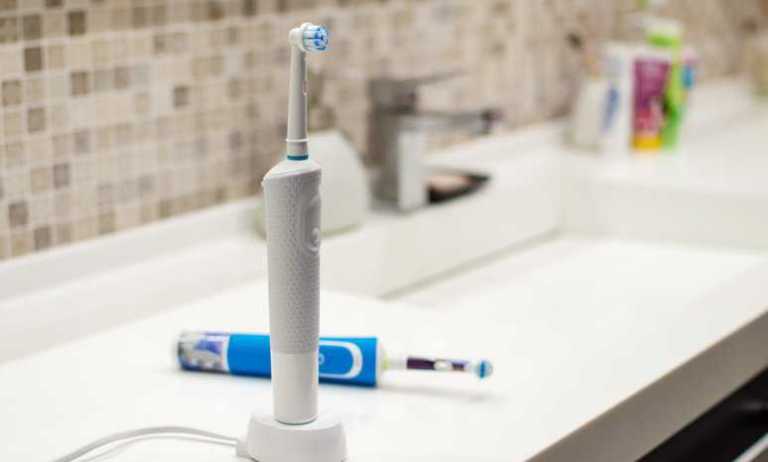 An electric toothbrush that is powered by an ANSI/NEMA MG 1-2021 electric motor.