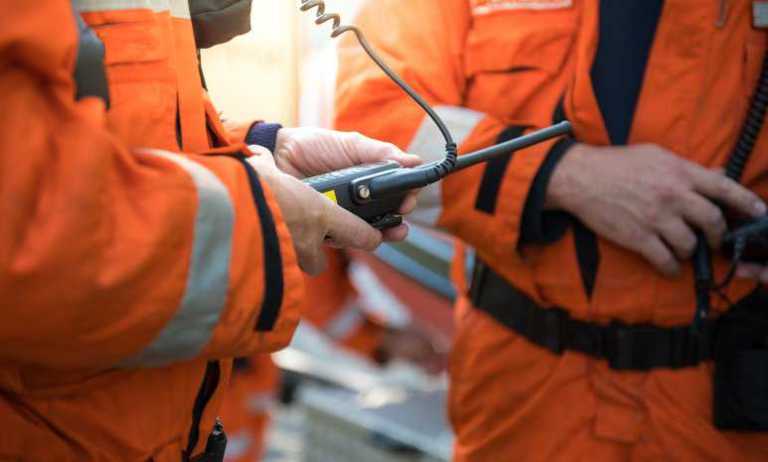 Firefighters connecting to other emergency workers via radio thanks to P25 CAP laboratory testing.