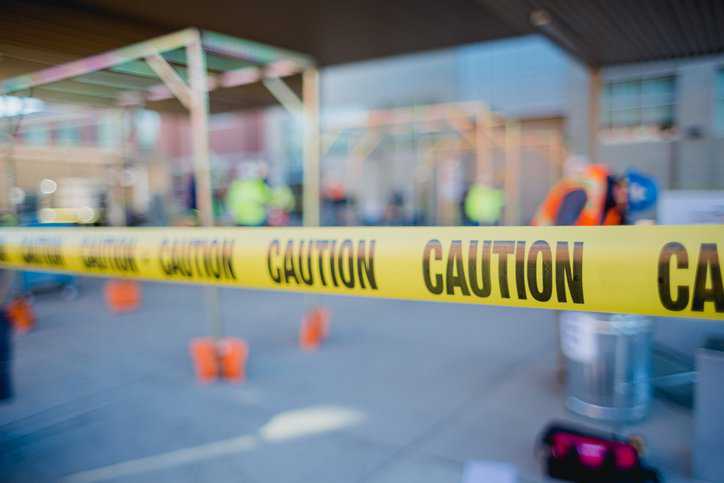 Caution Barricade Tape at Construction Site Adhering to ANSI Z535.5-2022 Standard.