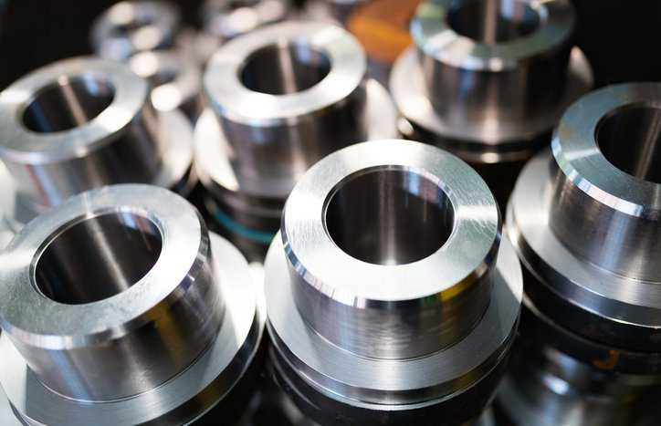 Shiny chrome metal bolts lined up and ready to get tested for ASTM D4541-22 adhesion / pull-off methods.