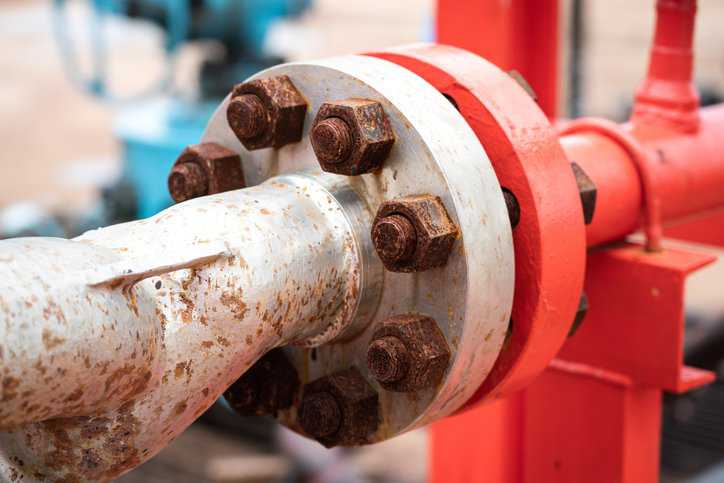 Bolted flange joint in piping system adhering to ASME PCC-1-2022.
