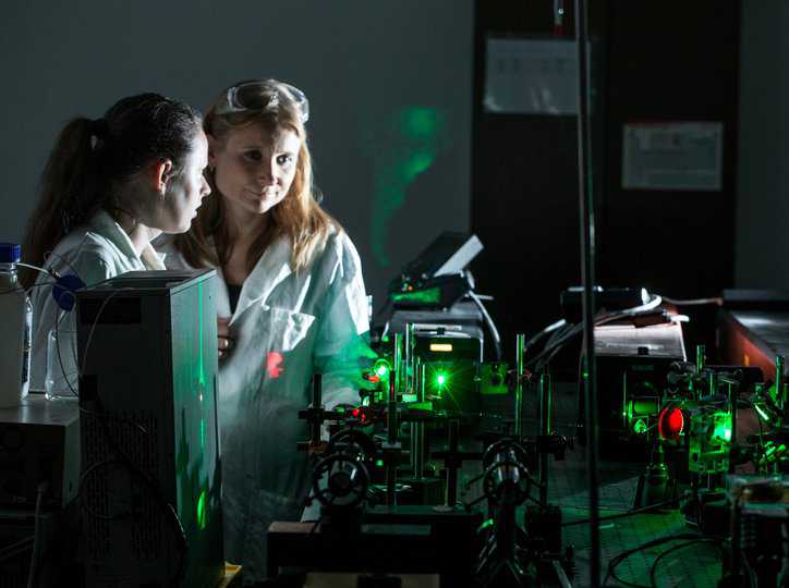 Researchers experimenting with Laser optical measurements, adhering to ANSI Z136.4-2021.