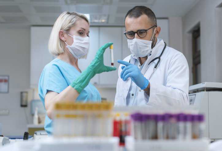 Scientists adhering to ANAB’s ISO 20387 Accreditation Program.