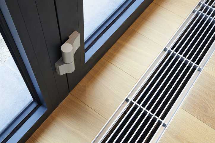Heating grid in wood beside door conforming to ASME PTC 4.3 air heaters requirements.