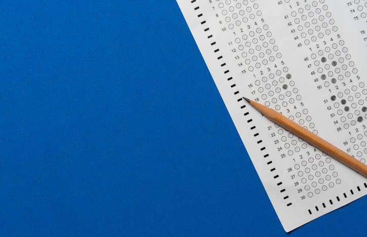 Multiple choice test on blue background that is clear to take due to item and form analysis adhering to ASTM E2659-18.