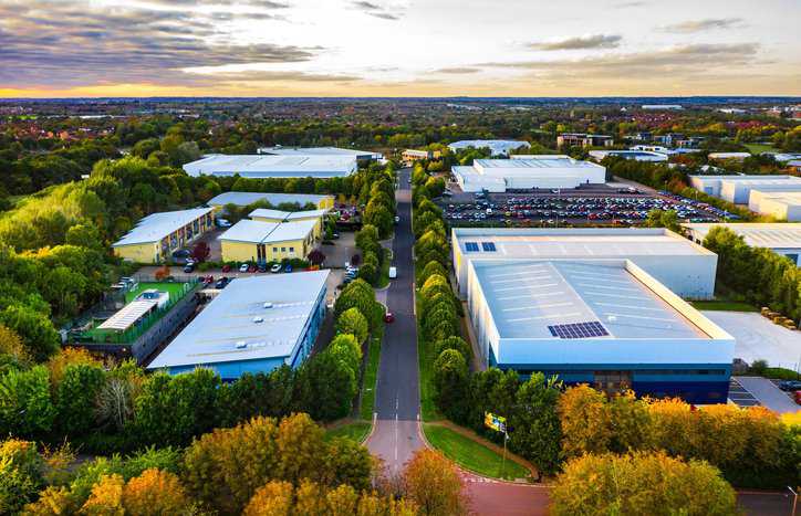A warehouse surrounded by greenery with FSSC 24000 social responsibility.