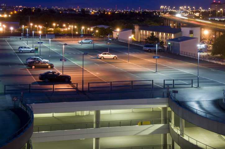 Public street lighting for security in a parking garage and in a city, adhering to IES G-1-22.