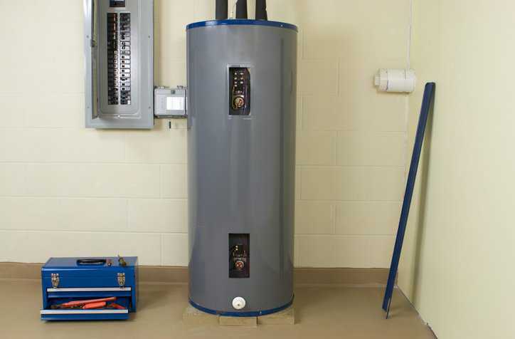 A gray residential water heater under ANSI Z21.10/CSA 4 repairs.