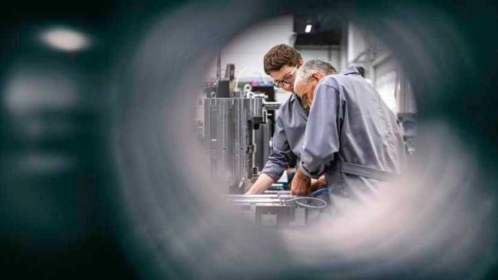 Through pipe of two people fixing machine in understanding the basic principles of the conformity assessment paradigm.