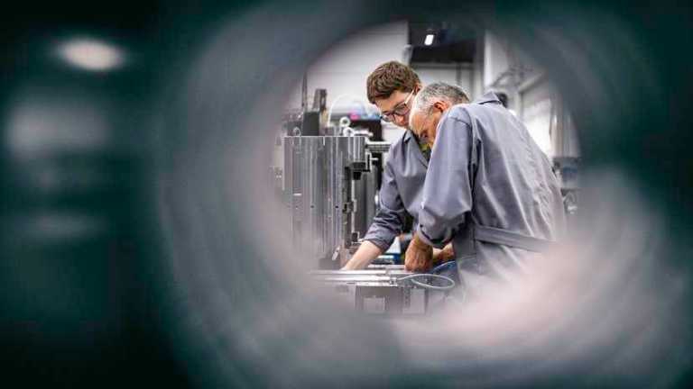 Through pipe of two people fixing machine in understanding the basic principles of the conformity assessment paradigm.