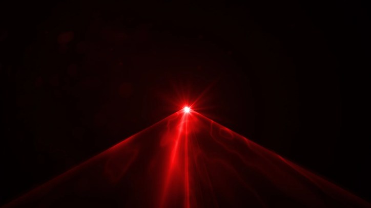 Red laser emitting through amplified darkness in ANSI Z136.1-2022 safe use.