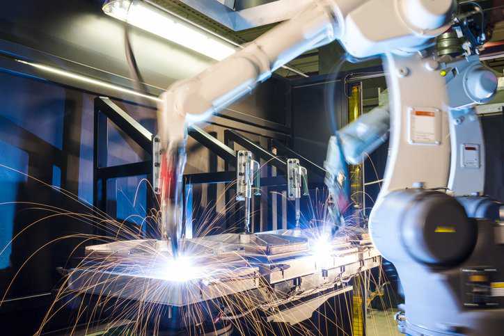 High-tech welding machine adhering to SRP/CS guidance in ISO 13849-1:2023.